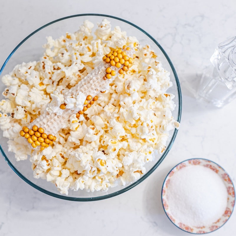 Poppin' Cobs popcorn packaging with a white background